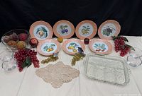Full lot with seven plates, glass tray, glass bowl and faux fruit