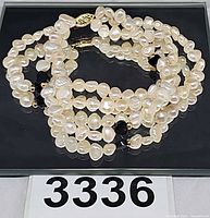 Bracelet coiled showing pearls, onyx beads and overall design