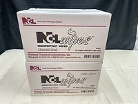 Front view of two stacked NCL disinfectant wipe cases showing branding and product details