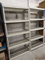 Front view of both shelving units showing five tiers each