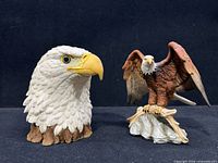 Both eagle figurines side by side