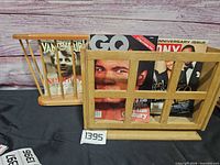 Front view of both magazine racks with magazines for scale