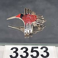 Front view of enamel hummingbird brooch showing colors and design