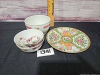 Group shot showing plate on stand, nested bowls and spoons