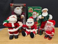 Group shot of all five Santa figurines with one in original box