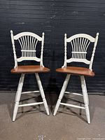 Front view of both stools showing overall design and condition