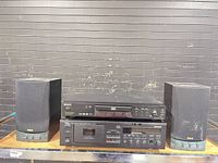 Full view of Sony DVD/CD player, Yamaha cassette deck, and pair of RCA speakers