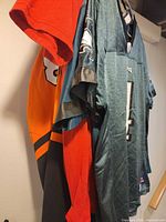 Group of four hanging sports tops