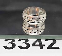 Ring front view showing braided design and band width