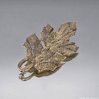 Front view of leaf brooch showing filigree and marcasite