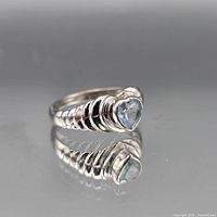 Front view showing heart-shaped blue topaz and ribbed shoulders