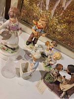 Assortment of Goebel figurines showing condition and details
