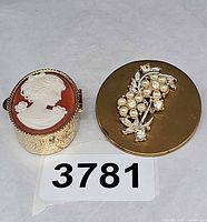 Cameo trinket box and compact mirror side by side