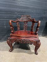 Front view of ornate rosewood armchair