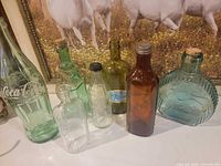 Group shot of all seven bottles on countertop