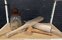 All items together: butter churn, rolling pin, mallet, paddle
