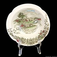 Single bowl front showing transferware scene and rim detail