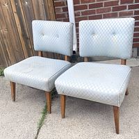 front three-quarter view of both chairs showing upholstery pattern and leg style