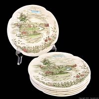 Stack of six plates, front view showing design