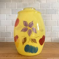 Front view showing hand-painted motif and lid
