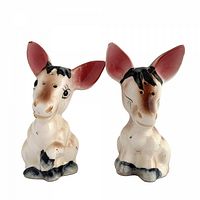 Front view of both donkey shakers showing overall design and painting