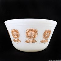 Full view of white milk glass bowl with gold sunflower pattern