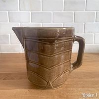Front view showing chevron ribbed pattern, spout and glaze