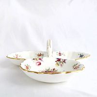 Angled side view highlighting depth, handle shape, gold edging