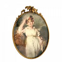 Front view showing brass frame and lithograph portrait