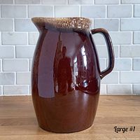 Right side view showing drip-glaze rim, handle and body finish
