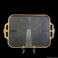 Top view of full tray showing harp and scroll pattern, gold gilt rim and handles