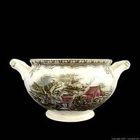 Front view of sugar bowl showing transferware scene and handles