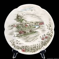 Front view showing full transferware scene and scalloped rim