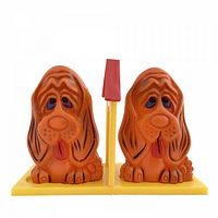 Front view of both Basset Hound shakers seated in tray