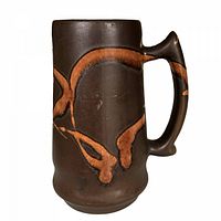 front view of stoneware beer stein showing amber swirl pattern