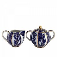 Front view showing creamer and lidded sugar bowl pattern and gold accents
