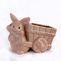 Front view of pink ceramic bunny rabbit pulling wagon planter