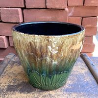 Front view of brown-green drip glaze planter