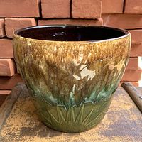 Front view of drip-glaze planter showing color transition and embossed design