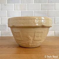 Side view showing embossed homestead design and glaze