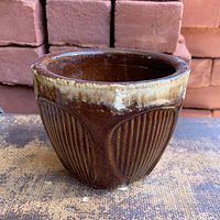 Side view showing ribbed Gothic arch design and drip glaze