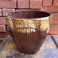Front view showing ribbed body and drip glaze