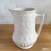 Front view of matte white Robinson Ransbottom Rosella pattern 320 pitcher