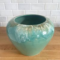 Front view of aqua drip glaze vase showing overall form and glaze pattern