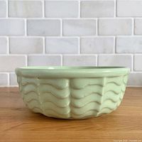 Side view of mint green wave pattern bowl