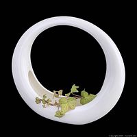 Front view of glossy white circular ceramic ring planter