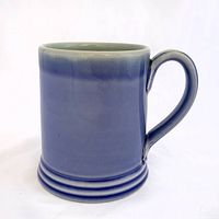 Profile view showing exterior glaze, handle, foot rings