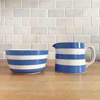 Front view of creamer and sugar bowl showing blue and white stripes