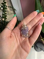 Front view of rough amethyst pendant with spiral wire wrap