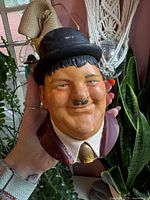 Front view of Oliver Hardy chalkware bust showing face, colors, and overall condition
